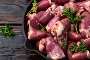Raw chicken giblets hearts , meat background