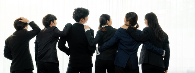 Panoramic banner back view of office worker team standing in line together with friendship posture symbolize successful professional teamwork and job employment, HR agency recruitment concept. Shrewd