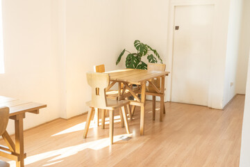 Modern interior of stylish dining room interior with family table and wood chairs,Neutral living room,stylish home decor,Template.