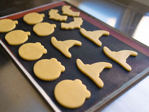 Unbaked homemade Halloween cookies on baking sheet