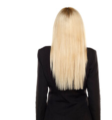 Rear view of a business woman with long blond hair on a white background