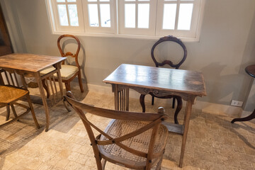Wooden table and chairs at cozy house or restaurant in room,modern home decor,Contemporary interior design of dining space,minimal concept.