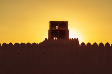 The city walls of the ancient city of Khiva at sunset. © lizavetta