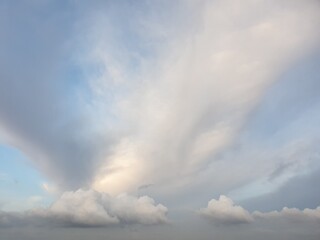Obraz premium The blue color sky with dark white clouds. The natural sky with clouds.