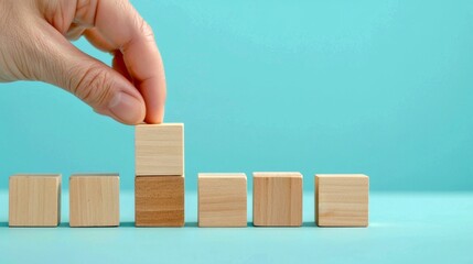 Hand arranging wooden blocks in ascending order on a turquoise background. This conceptual image represents growth, organization, and progress. Suitable for business or educational content. AI