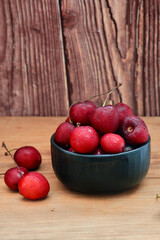 ripe cherries on a dark wooden background