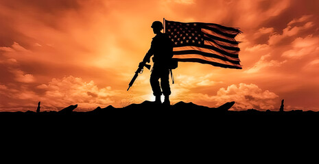 A soldier stands in front of a large American flag.