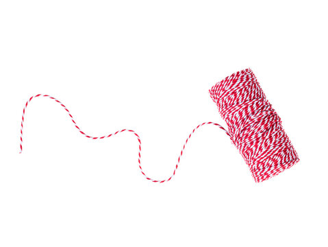christmas red and white bakers twine rope spool isolated on white background. Packaging equipment for gift box or handicraft tool concept
