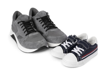 Big and small sneakers isolated on white