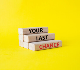 Your last Chance symbol. Concept words Your last Chance on wooden blocks. Beautiful yellow background. Business and Your last Chance concept. Copy space.