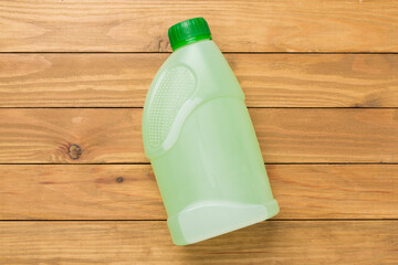 Can with antifreeze on concrete background, top view