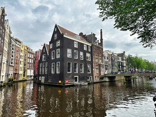Obraz premium Amsterdam, the capital of Netherlands, is known for its artistic heritage, elaborate canal system and narrow houses!!