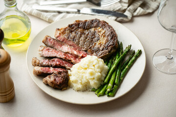 ribeye steak with asparagus and mushed potato