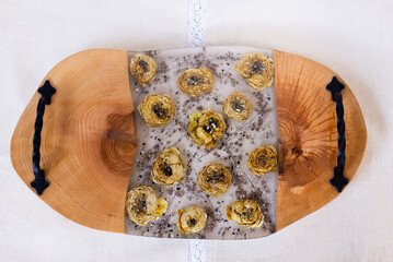 Kitchen board made of wood and epoxy resin. A tray of dried flowers and epoxy. Hand made