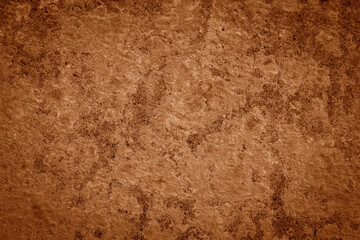Dark red-orange-brown rock texture with cracks