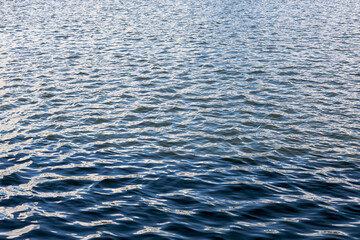 the surface of the water with waves
