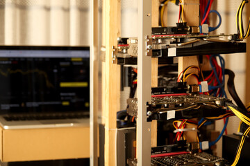 Homemade cryptocurrencies mining farm. Bitcoin and other cryptocurrencies mining farm featuring GPU...