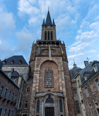 Fototapeta premium Aachen Cathedral seen from the west. The westwork (western facade) of the cathedral is of Carolingian origin Romanesque style with a few Neo Gothic additions