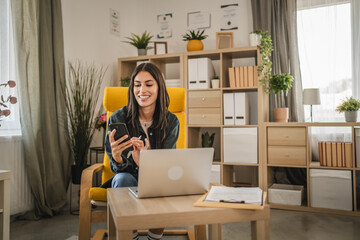 Adult woman work from home take a break and use mobile phone