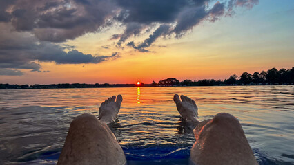 Watching sunset floating in river