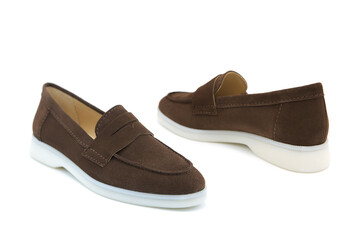 Pair of fashionable stylish suede leather loafer shoes isolated on white background. View from all sides.