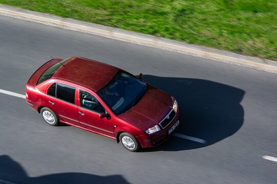 Red Skoda Fabia Sedan with motion blur effect