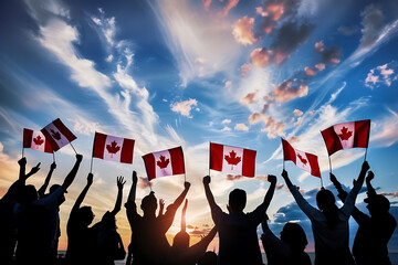 Silhouettes of people waving Canadian flags against a sunset sky, celebrating Canada Day with patriotic pride. 
