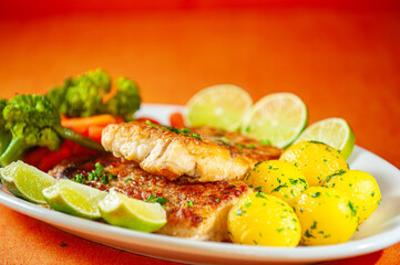 fish fillet with vegetables and boiled soute potatoes,