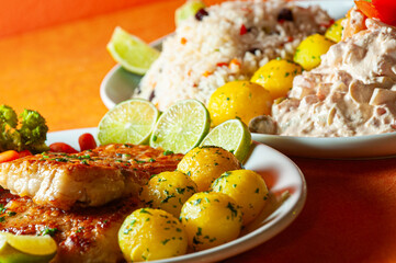 Seafood with pasta sauce, Greek rice and potatoes.