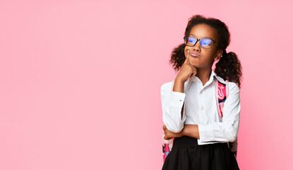 Little Girl Missing School During Coronavirus Quarantine Standing Over Yellow Background. Studio...