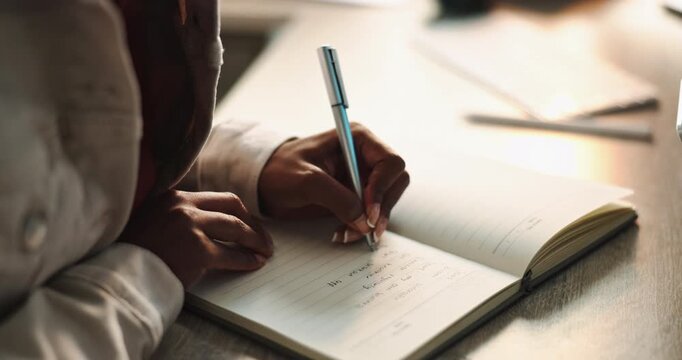 Hands, woman and writing in notebook or journal for ideas, planning and schedule as student. Female person, diary and agenda with wishlist or goals for future, vision and mission with affirmations