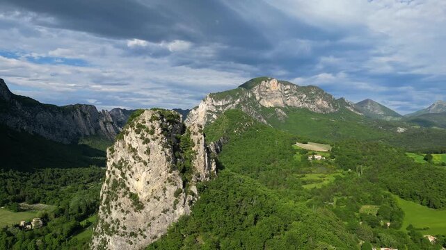 Panoramic mountain view near the village of Saou in the Drome department in France of the Vercors hills, the marly hills and the Val de Drome valley. The Saou forest and the 3 peaks - Drome Valley