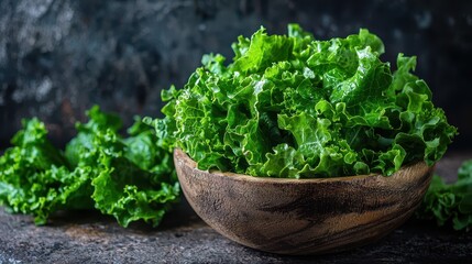 Green lettuce leaves overflow from a rustic bowl, showcasing a fresh and vibrant display of healthy eating.






