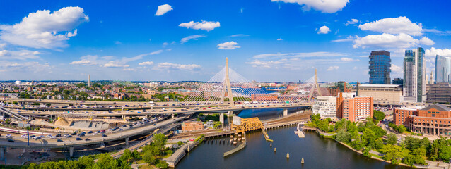 Amazing aerials of Downtown Boston. View of river bridges skyscraper offices and blue sky 2024