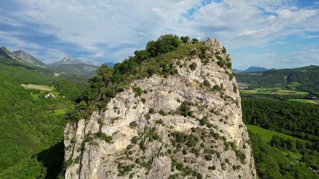 Panoramic mountain view near the village of Saou in the Drome department in France of the Vercors hills, the marly hills and the Val de Drome valley. The Saou forest and the 3 peaks - Drome Valley