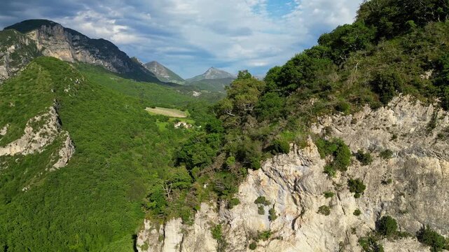 Panoramic mountain view near the village of Saou in the Drome department in France of the Vercors hills, the marly hills and the Val de Drome valley. The Saou forest and the 3 peaks - Drome Valley