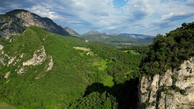 Panoramic mountain view near the village of Saou in the Drome department in France of the Vercors hills, the marly hills and the Val de Drome valley. The Saou forest and the 3 peaks - Drome Valley