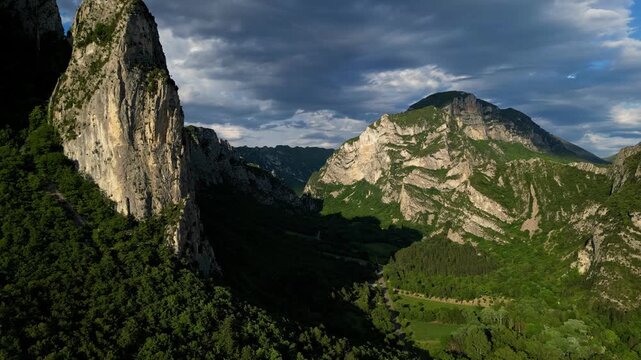 Panoramic mountain view near the village of Saou in the Drome department in France of the Vercors hills, the marly hills and the Val de Drome valley. The Saou forest and the 3 peaks - Drome Valley