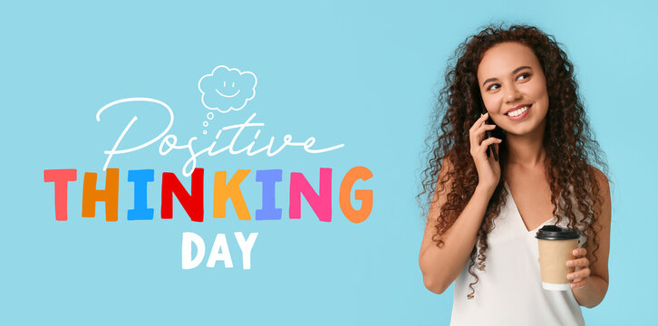 Happy young African-American woman with paper cup of coffee talking by mobile phone on blue background