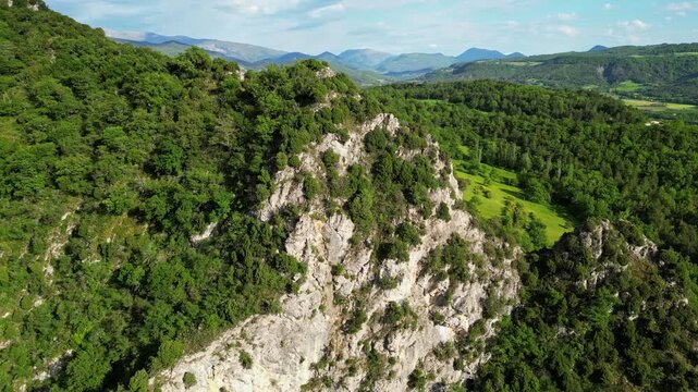 Panoramic mountain view near the village of Saou in the Drome department in France of the Vercors hills, the marly hills and the Val de Drome valley. The Saou forest and the 3 peaks - Drome Valley