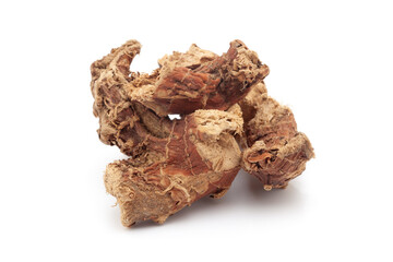 Close-up of Dry Organic Kulanjan (Alpinia galanga) roots, isolated on a white background. Front view