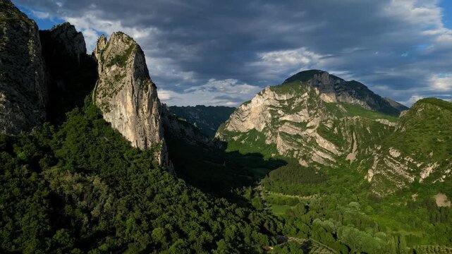 Panoramic mountain view near the village of Saou in the Drome department in France of the Vercors hills, the marly hills and the Val de Drome valley. The Saou forest and the 3 peaks - Drome Valley