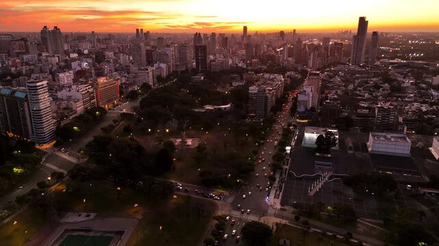 Panoramic view of Buenos Aires during sunset. Aerial shot tracking backwards from the Recoleta neighborhood with Floralis Generica