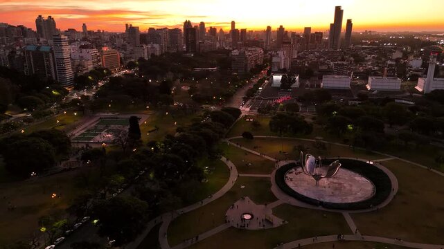 Panoramic view of Buenos Aires during sunset. Crane shot descends on the Floralis Generica sculpture