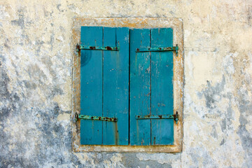 The window of an old house in Othonoi island, Greece