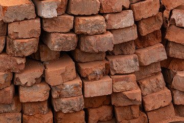Stack of reclaimed bricks prepared for construction work. The concept of construction and restoration technology.