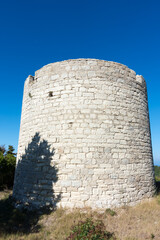Naklejka premium The ruins of an old windmill in Othonoi island, Greece
