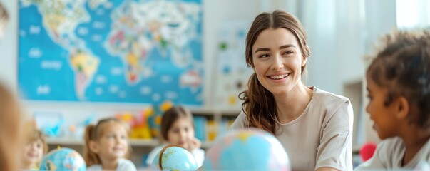 Happy teacher with diverse group of children exploring world globes in a classroom