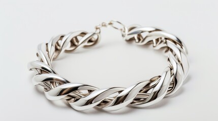 Naklejka premium Add a touch of luxury to your outfit with a sleek silver bracelet against a white backdrop