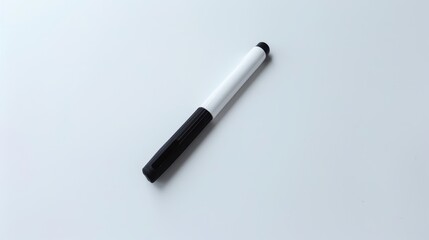 Black and white dry erase marker on white surface, ideal for writing and drawing in educational and professional settings. Simple, efficient design for offices and schools
